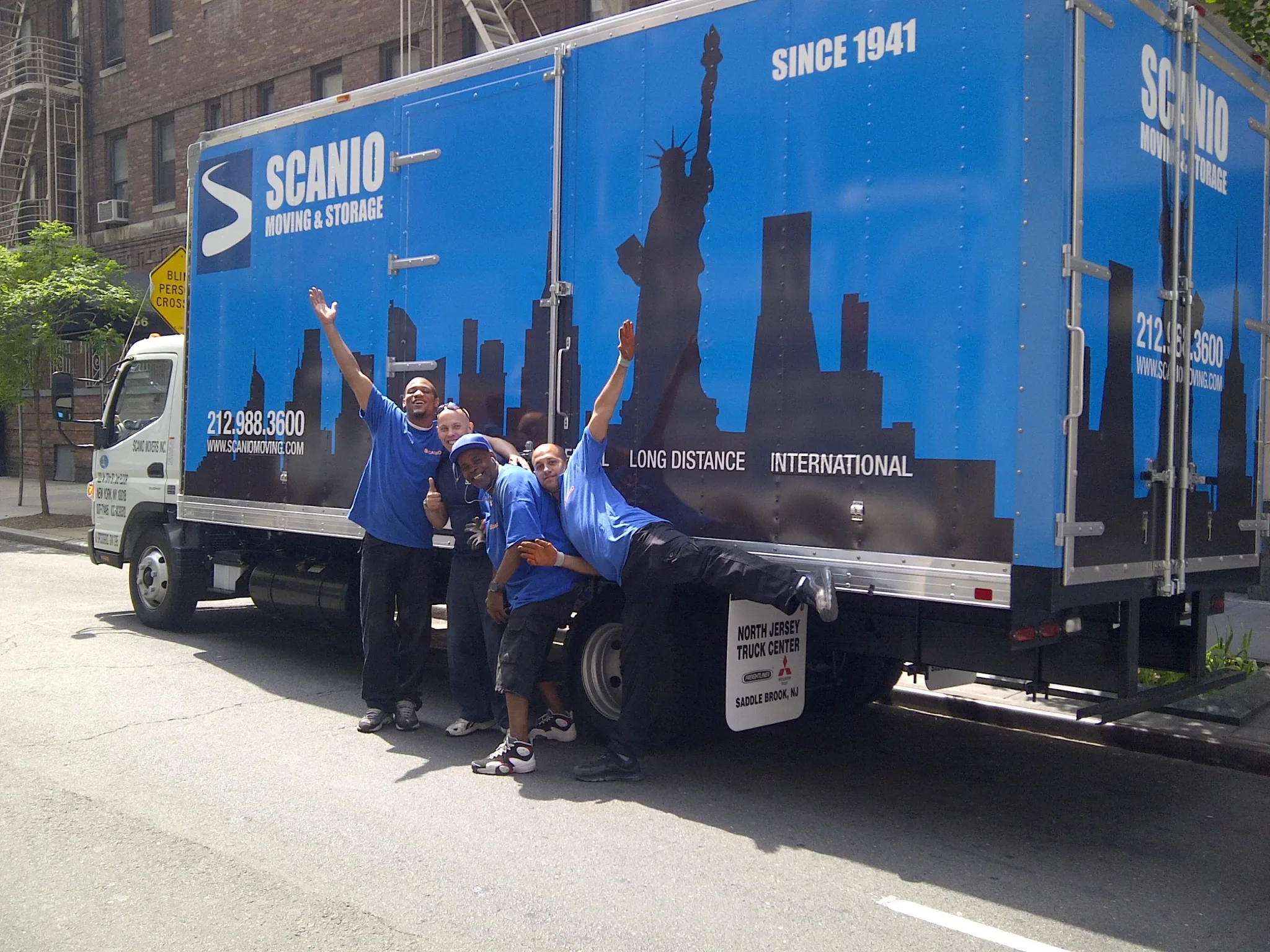 Scanio crew in front of the company truck on a New York City street